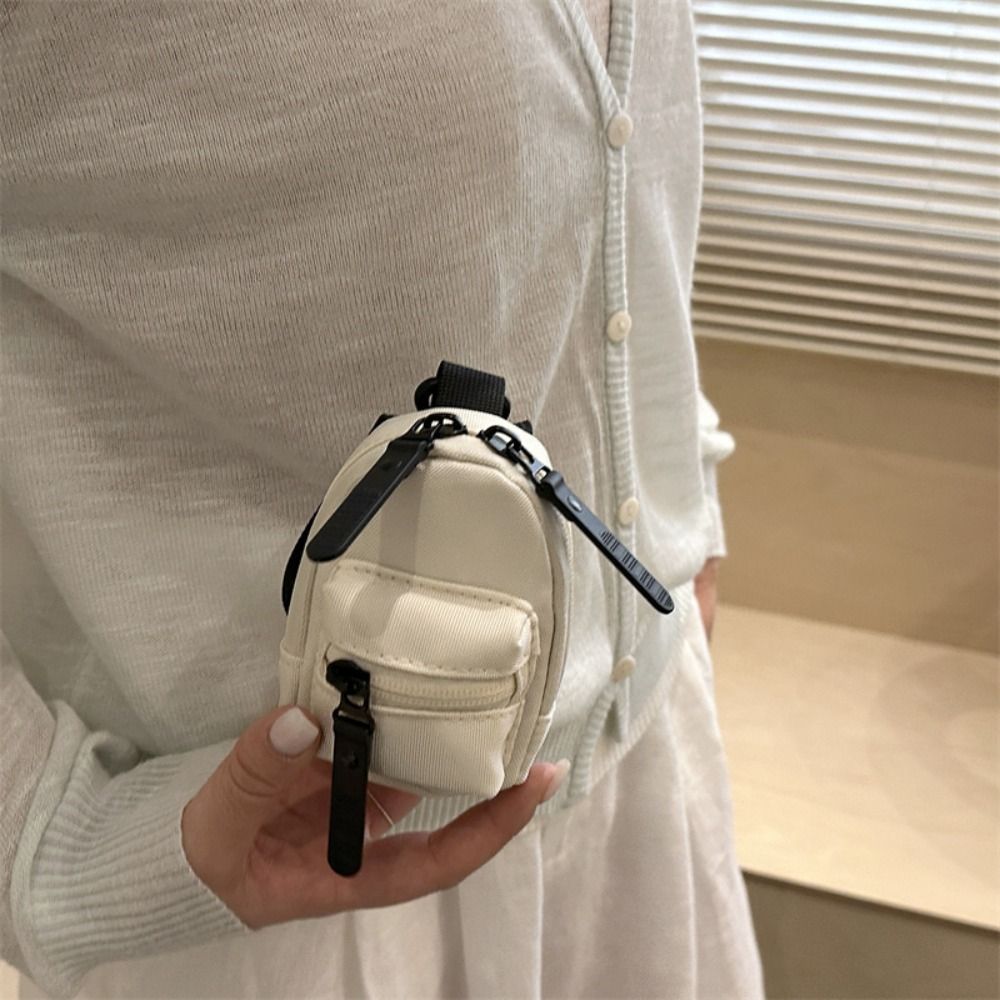 محفظة نقود صغيرة ملونة على شكل - مراجعة Mini Backpack Purse وسعره